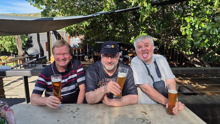 Rob Murphy, Francois and Trevor Lunt raise a glass in the garden