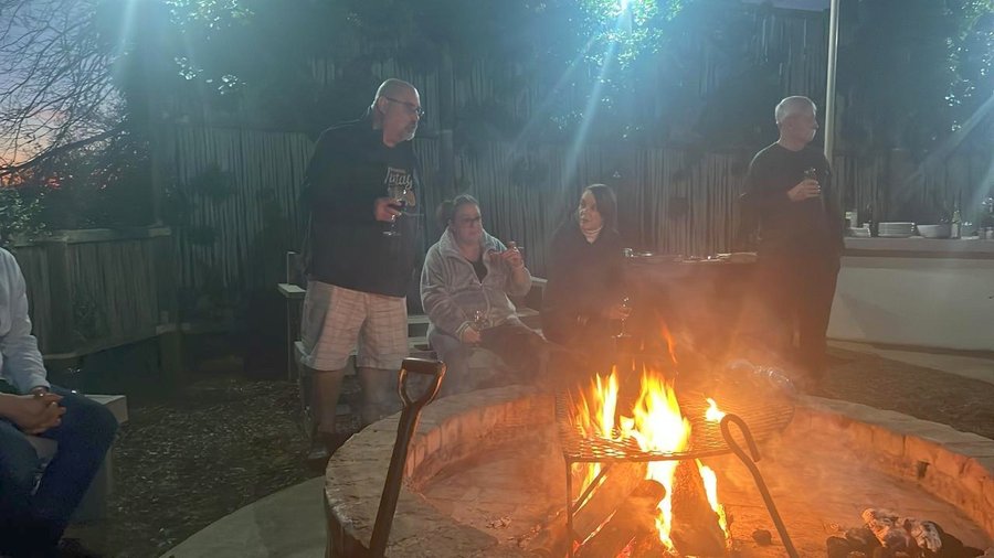 Francois and Lisa van Heyningen, Stacy and Gary as the fire gets going at dusk