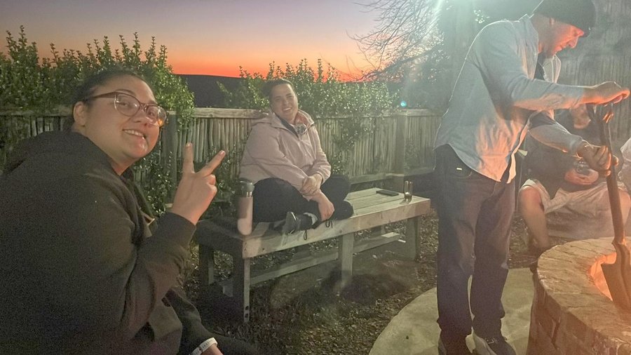 Kim Noels, with Ruth and Justin Schonegevel, as the sun goes down